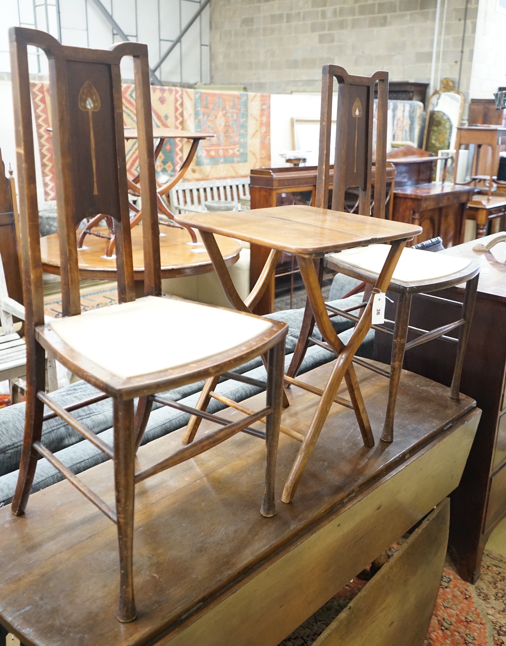 A small late Victorian rectangular folding occasional table, width 44cm, depth 40cm, height 58cm together with two Art Nouveau inlaid side chairs